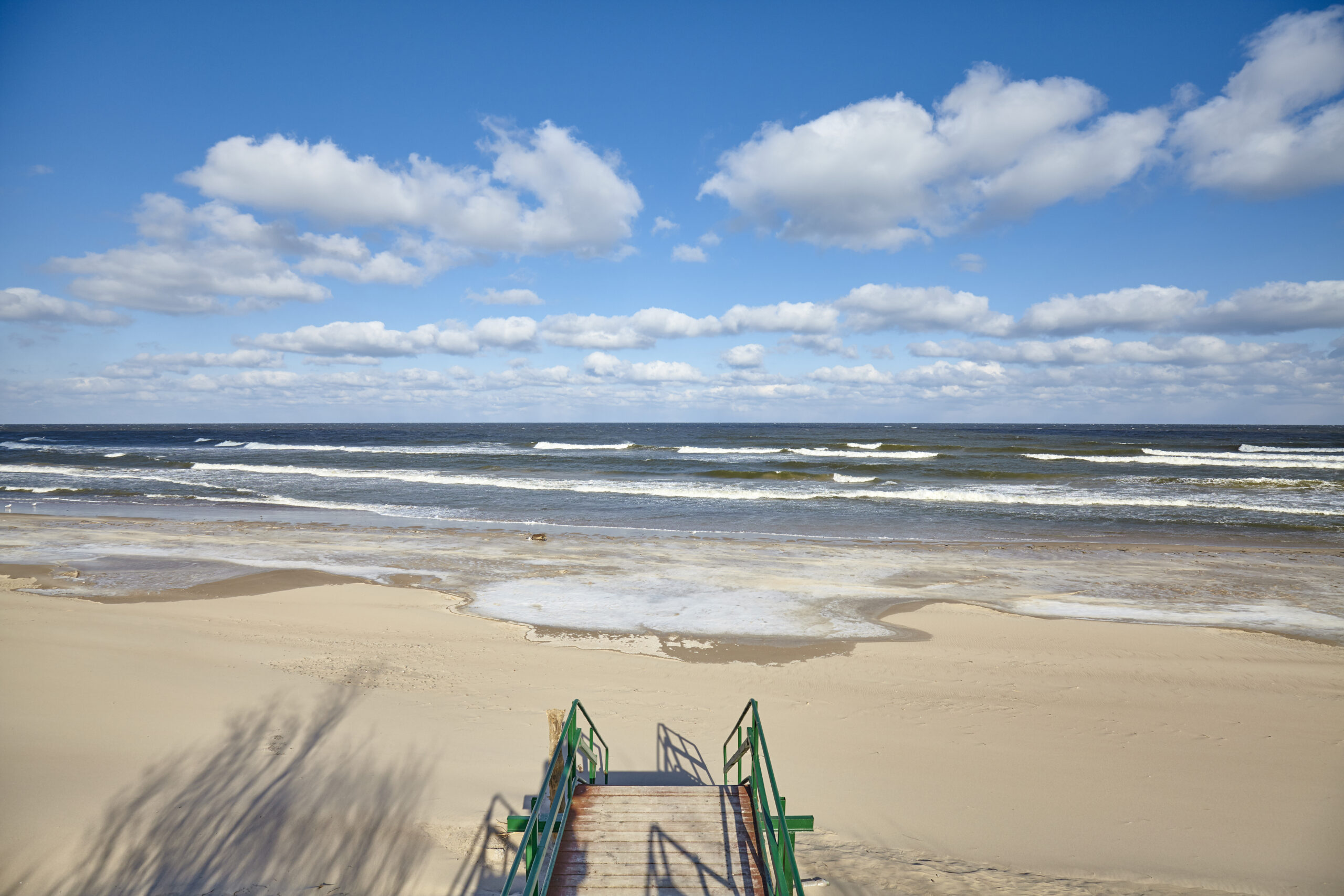 Stairs to an empty beach in Dziwnowek, Poland.